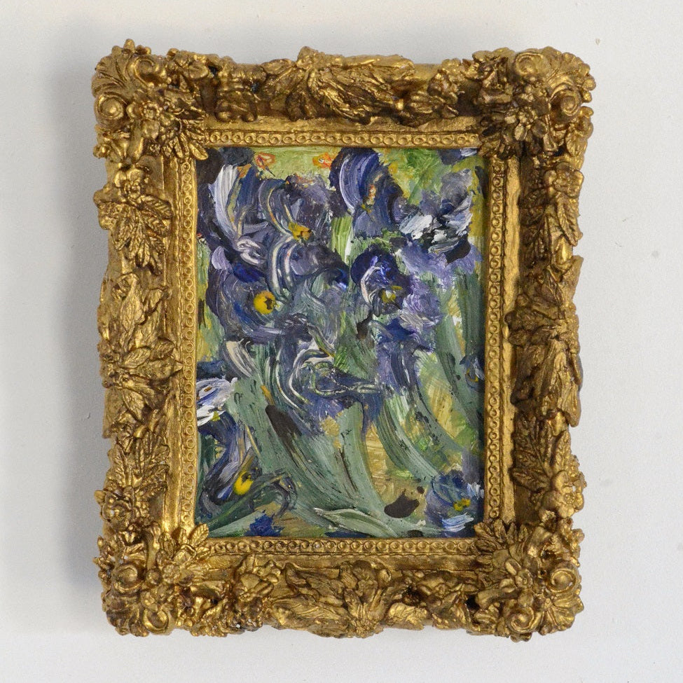 painted blue flowers in a gold frame
