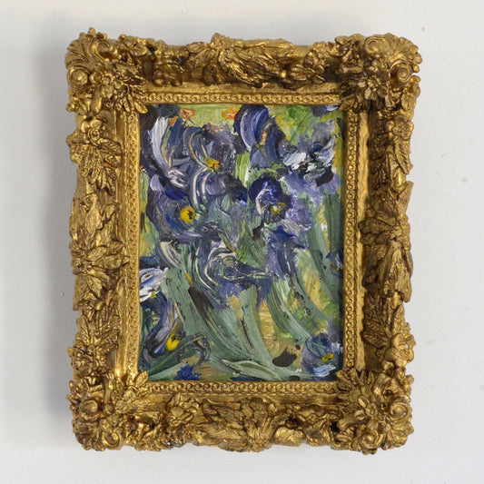 painted blue flowers in a gold frame