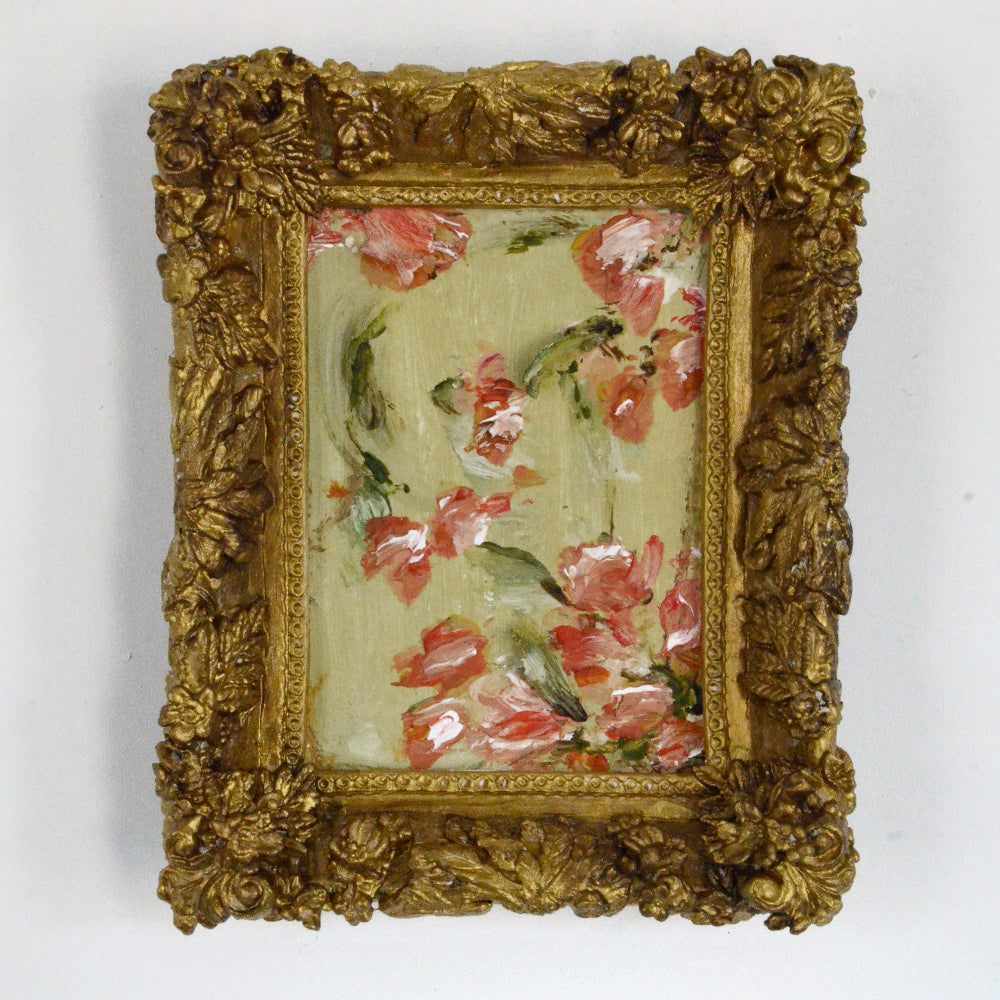 Decorative painting with floral design in a gold frame on a white background