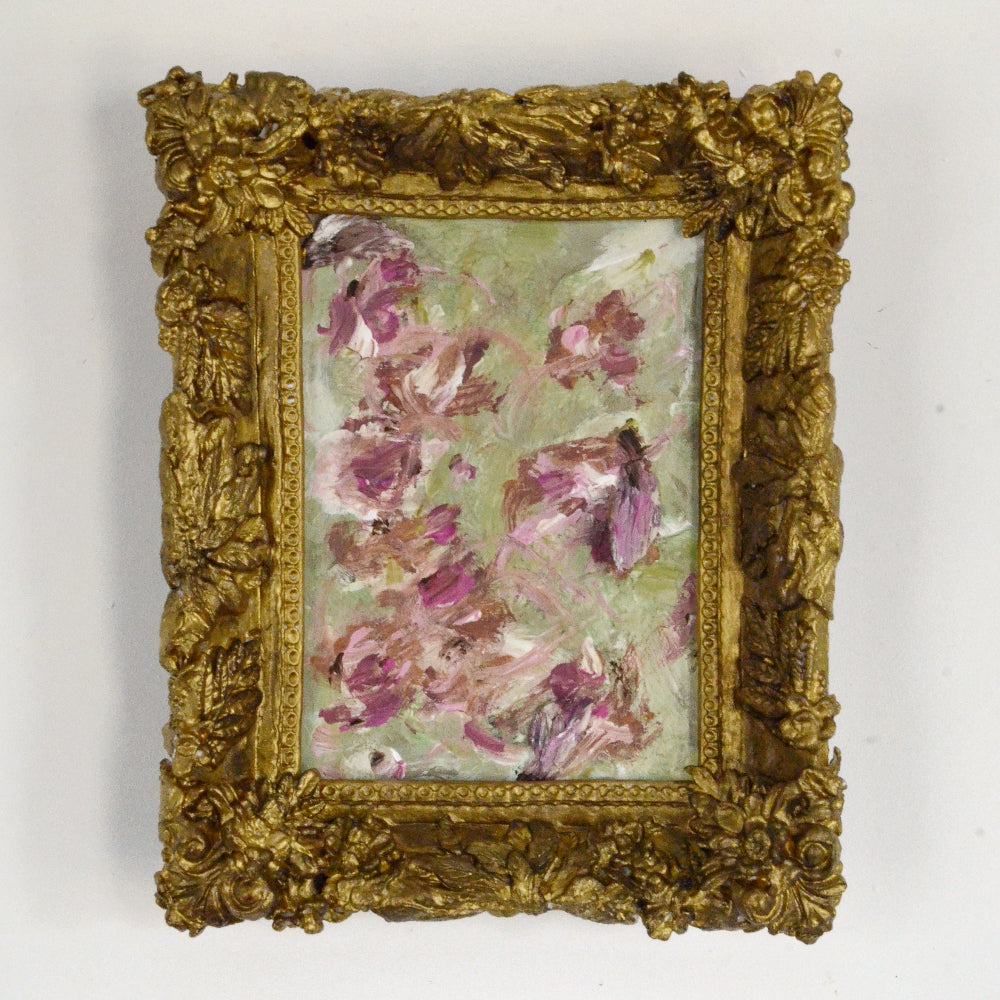 Framed artwork with floral design on a white background