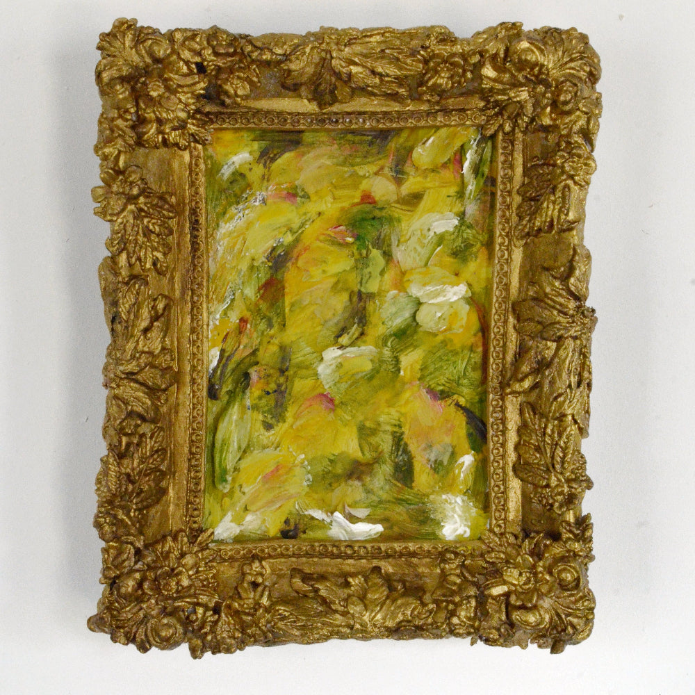 Small oil painting in a decorative gold frame on a white background