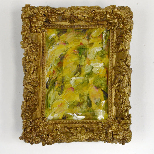 Small oil painting in a decorative gold frame on a white background